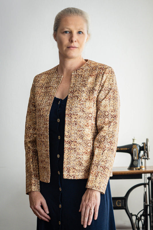 Model wearing golden rust silk jacquard jacket with sequin embroidery – STOVARIA
