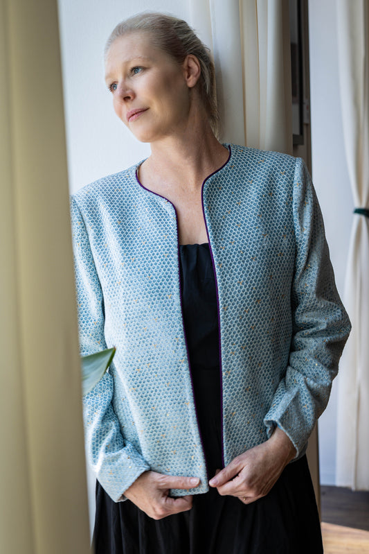 Model wearing handcrafted sky blue velvet jacket with gold embroidery – STOVARIA