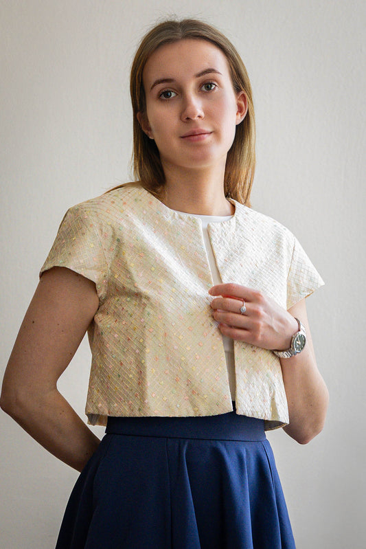 Silk crop coat with pastel embroidery in soft tones