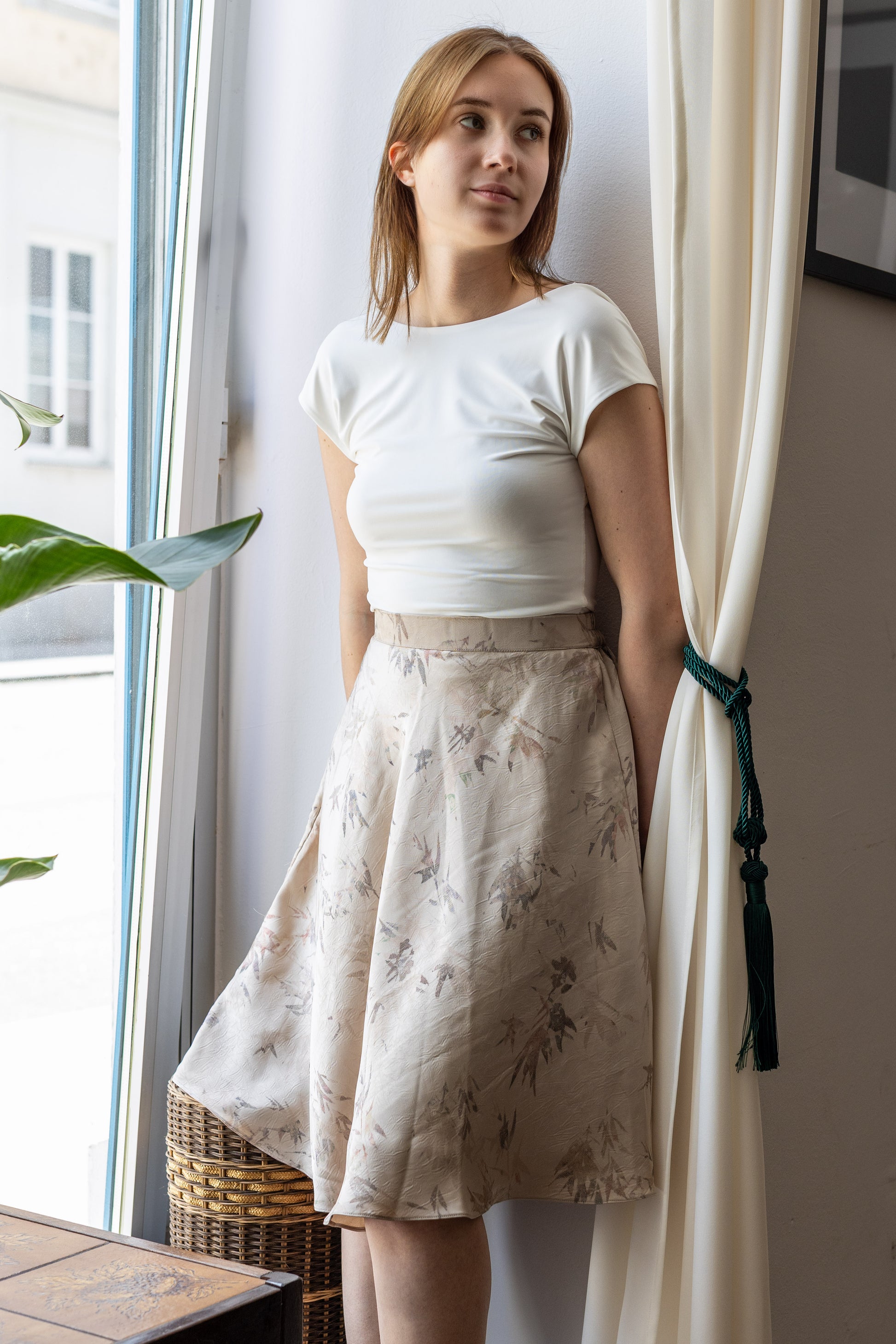 Beige satin crushed skirt knee length on model