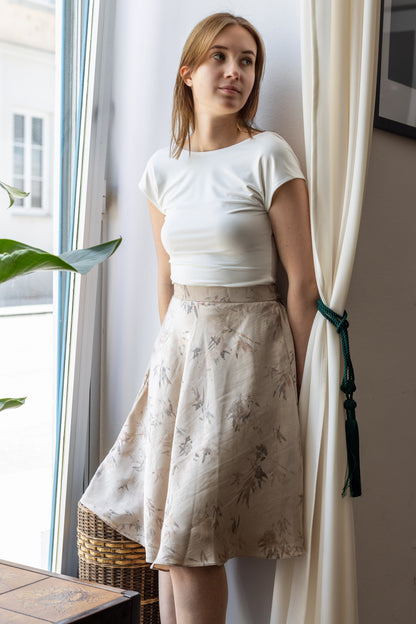Beige satin crushed skirt knee length on model