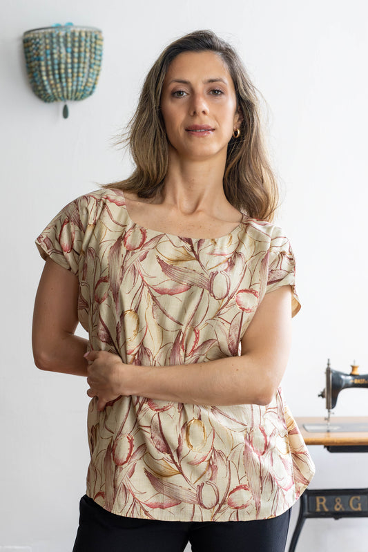 Floral cotton-silk blouse with boat neckline worn by model