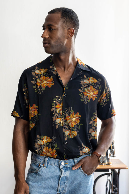 Man wearing black floral summer shirt in cotton-silk blend