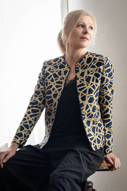 Model wearing handcrafted Tussar silk jacket with gold and silver embroidery by STOVARIA