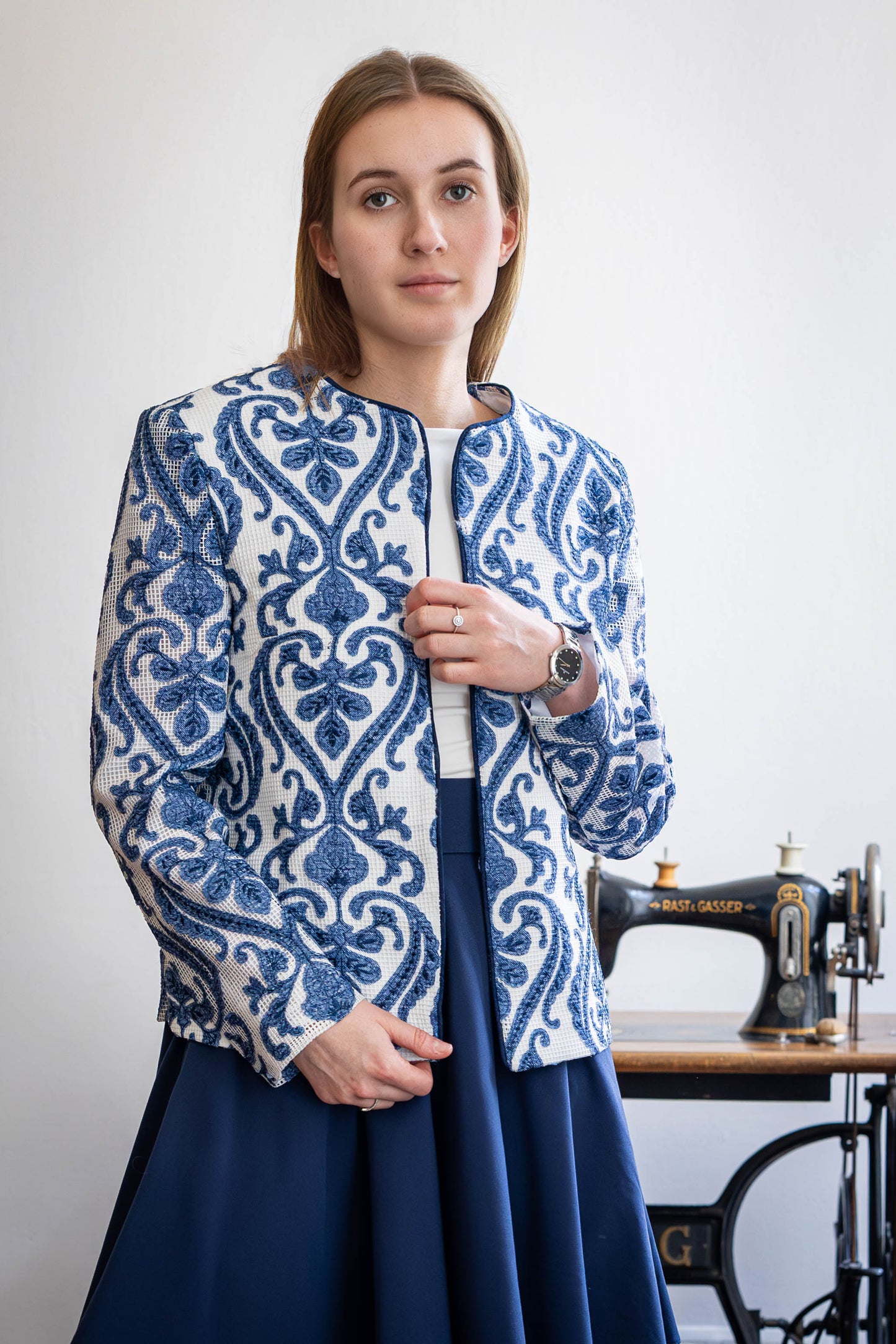 Model wearing sheer ivory jacket with indigo vine embroidery – handcrafted by STOVARIA