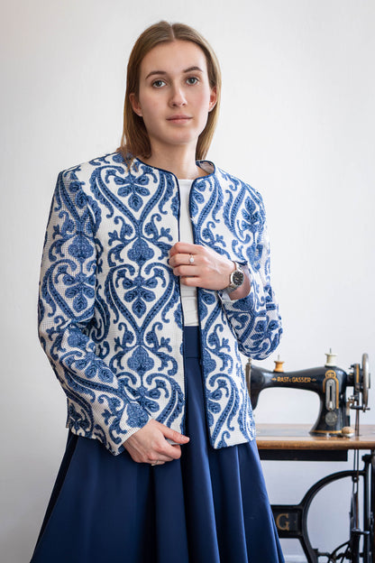 Model wearing sheer ivory jacket with indigo vine embroidery – handcrafted by STOVARIA